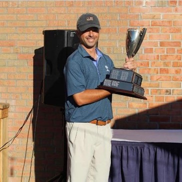 Todd Shagin Holding golf trophy