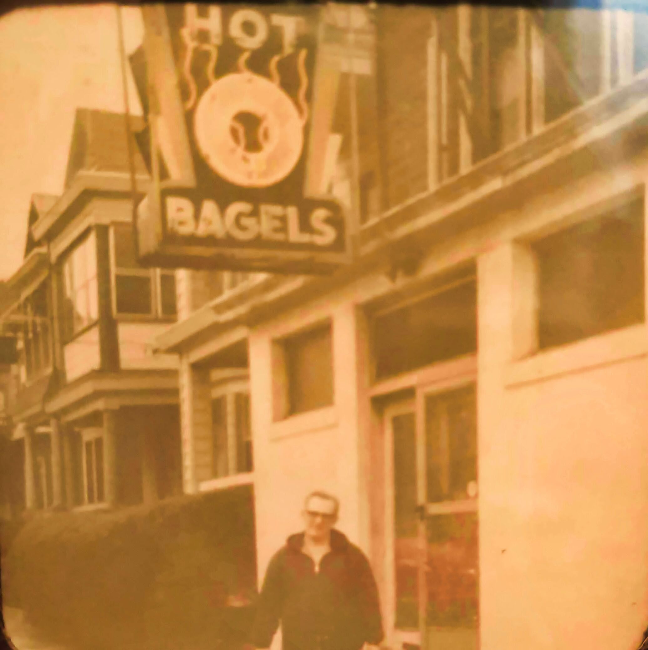 Morris Cohen under bagel sign