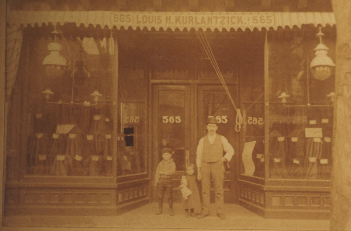 Louis Kurlantzick in front of his store,
