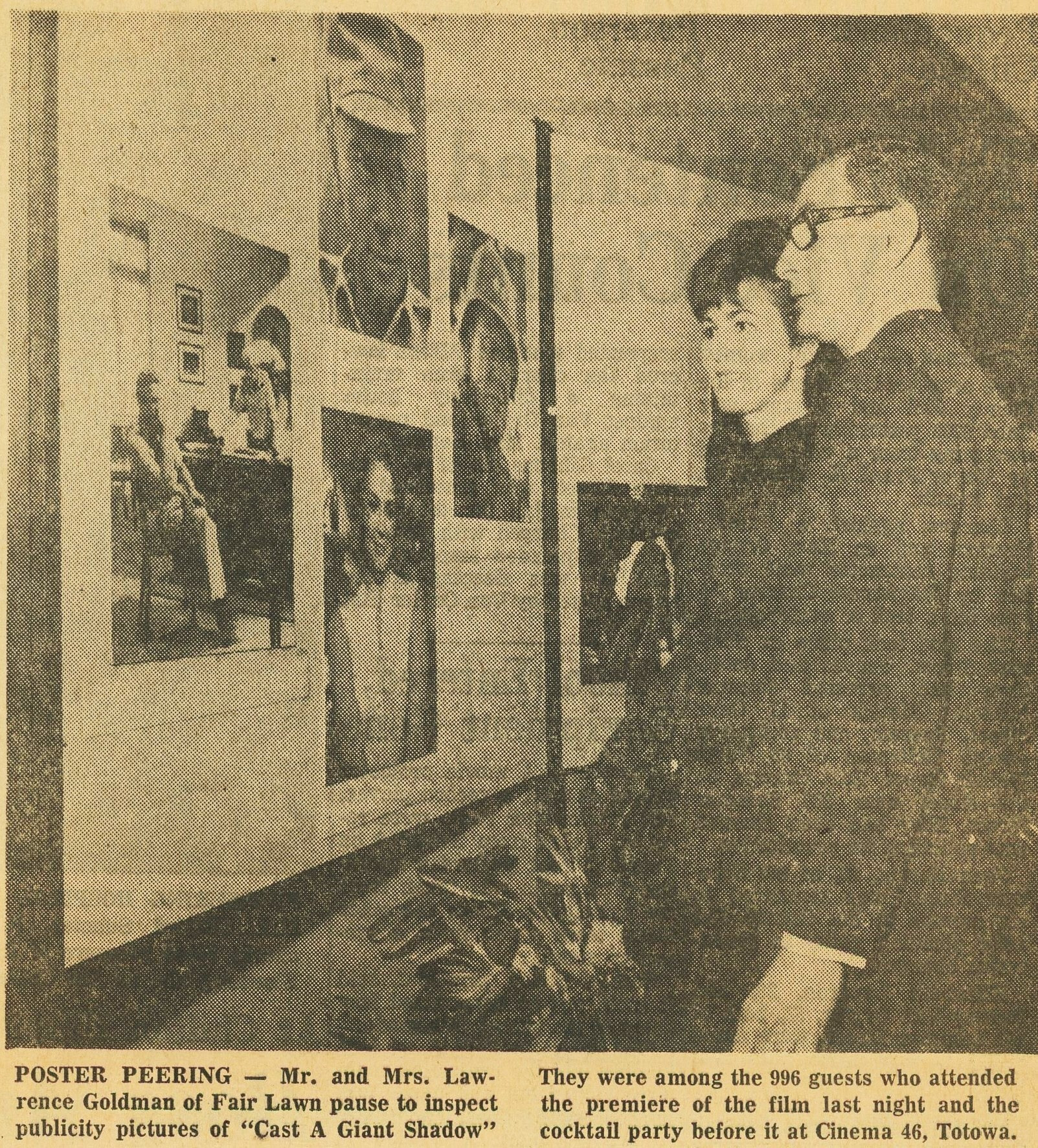 Mr and Mrs Lawrence Goldman viewing publicity pictures