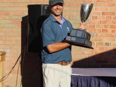 Todd Shagin Holding golf trophy