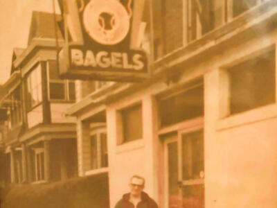 Morris Cohen under bagel sign