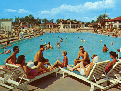 People lounging at a pool in a Catskills resort